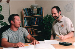 Photo of David with a student